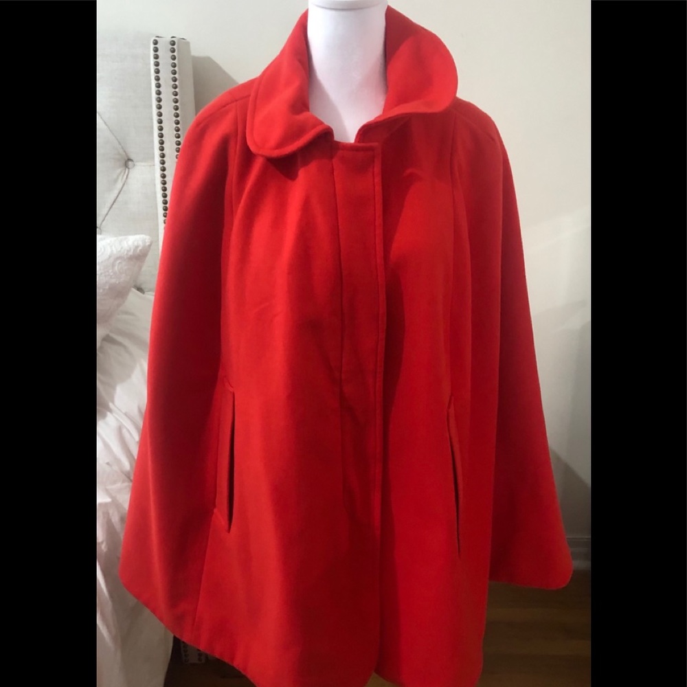 Orange cape,zipper in front, with arm slits.